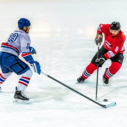 Two ice hockey players  in action, high angle view.