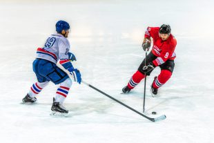 Two ice hockey players  in action, high angle view.